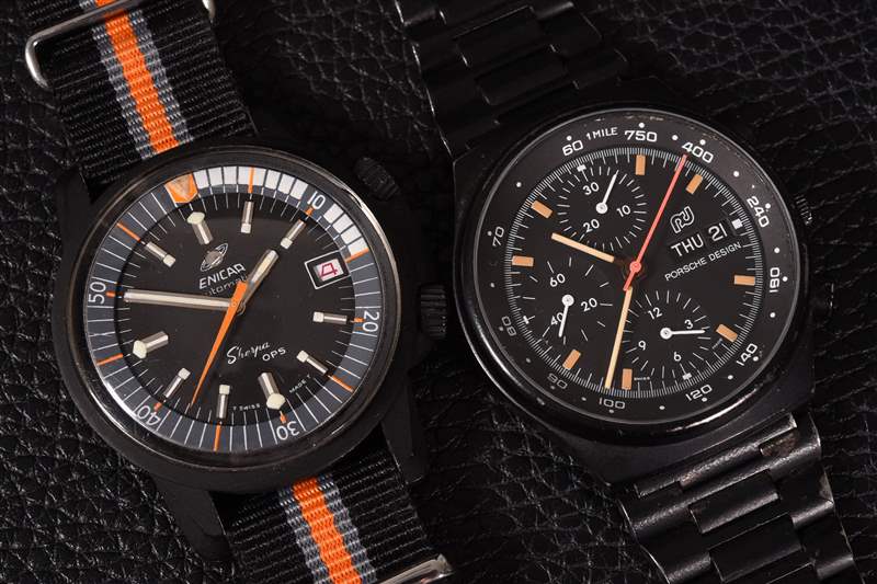 黑色背景中的兩塊黑色涂層手表